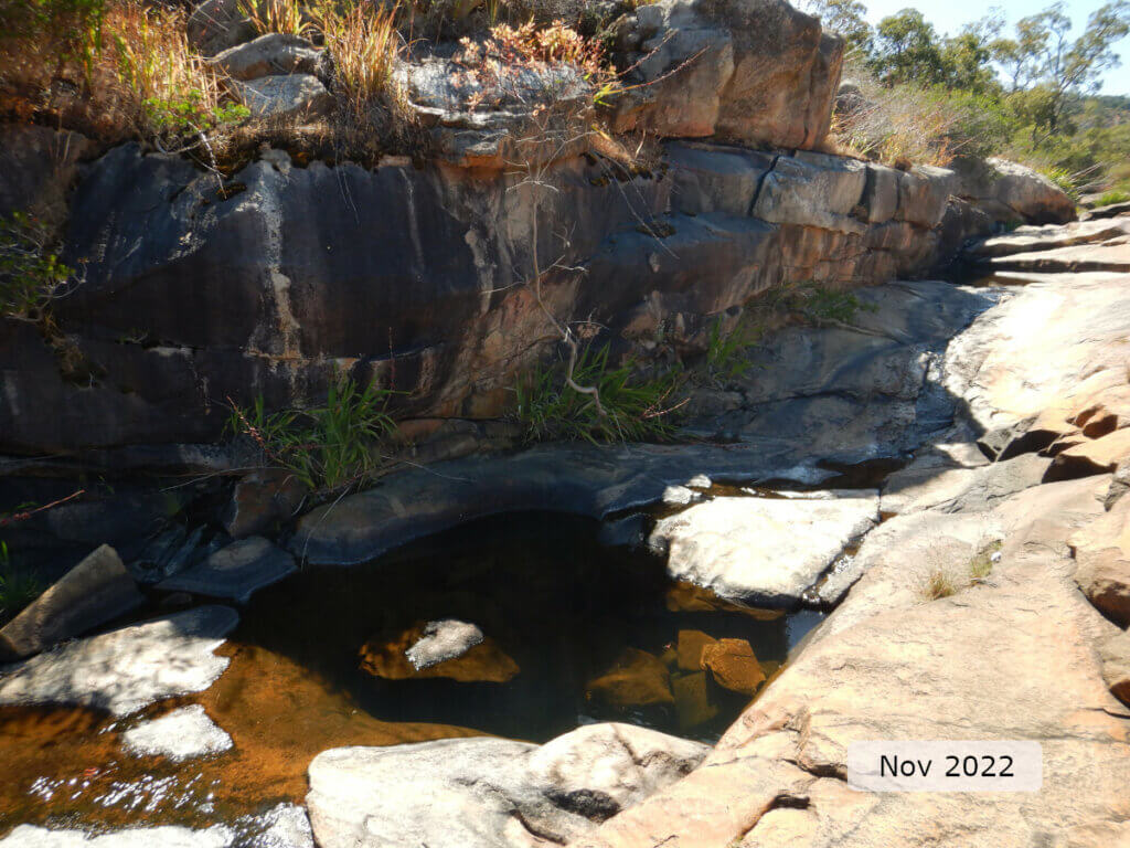 An image showing a rock pool shaded by the rock shelf at the Susannah brook site.